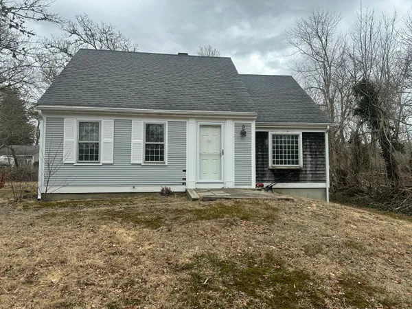 a house with trees in front of it