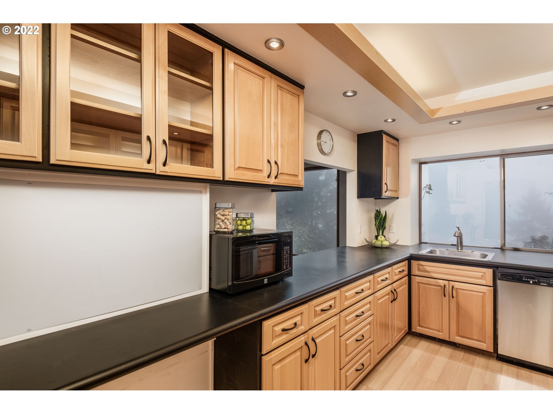 635 Startouch Drive Eugene, OR 97405 - Photo 12 of 28 a kitchen with stainless steel appliances granite countertop a sink a stove and a microwave