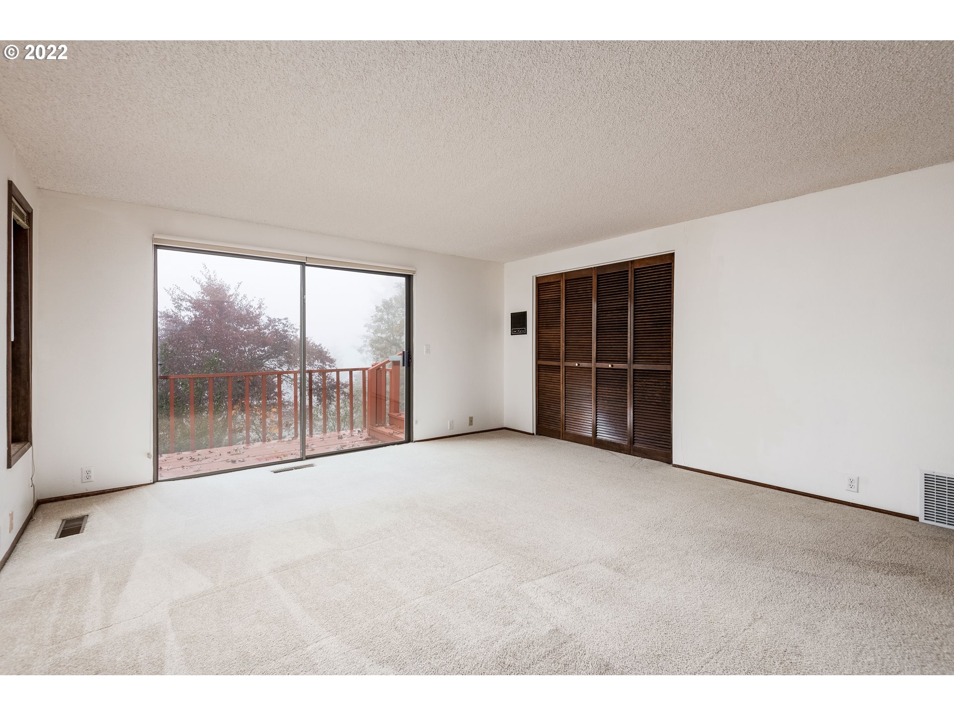 635 Startouch Drive Eugene, OR 97405 - Photo 17 of 28 a view of an empty room with a window