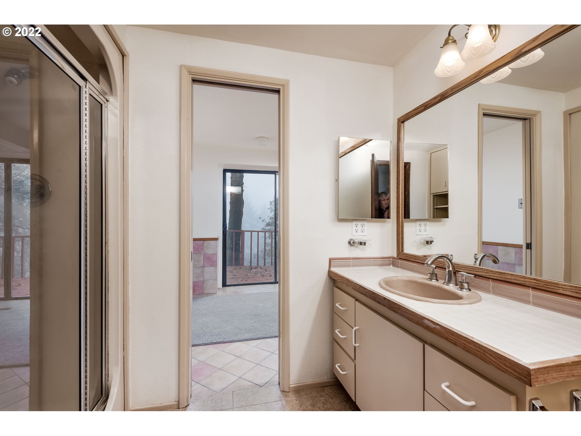 635 Startouch Drive Eugene, OR 97405 - Photo 18 of 28 a bathroom with a sink and a mirror