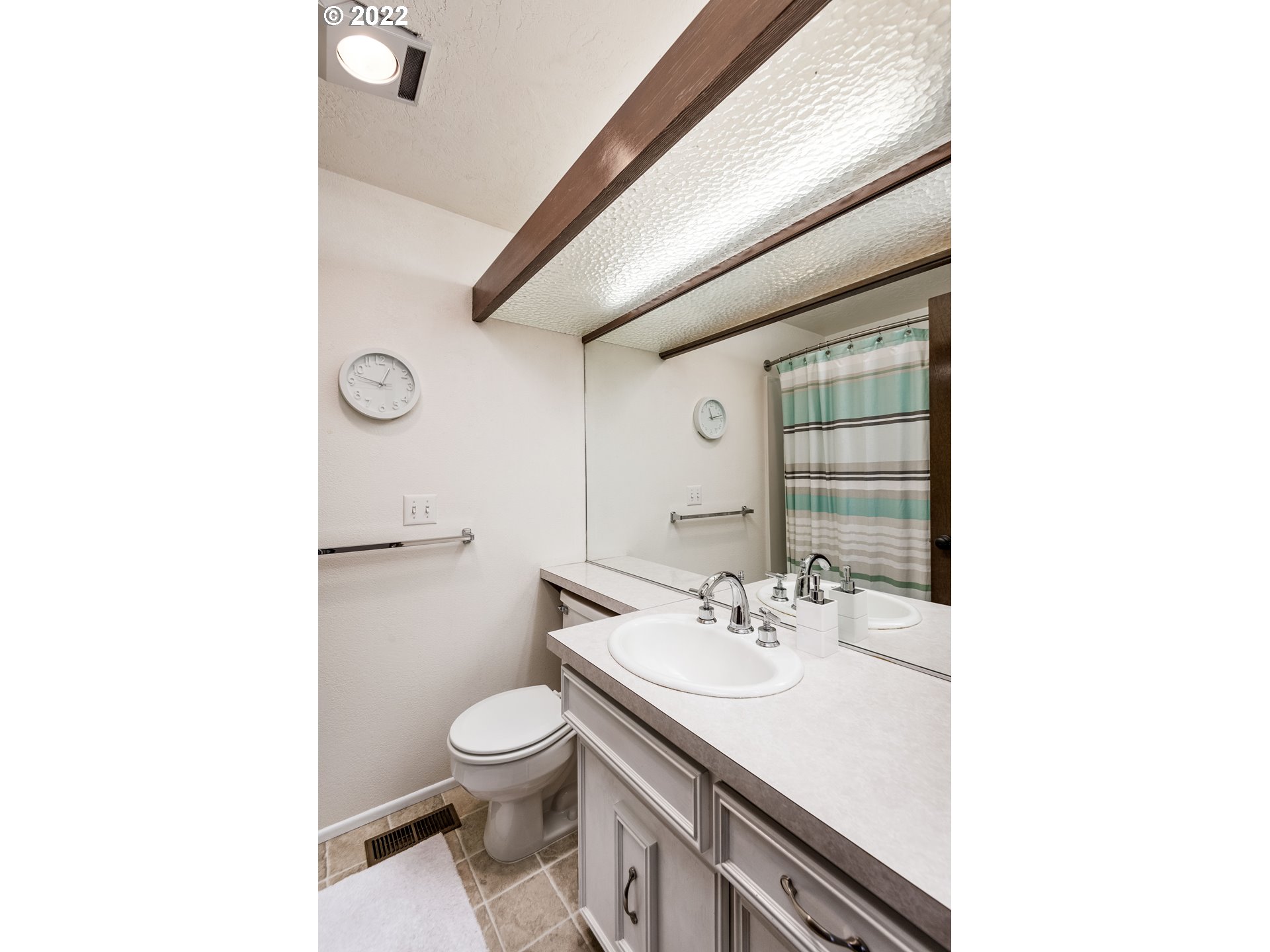 635 Startouch Drive Eugene, OR 97405 - Photo 21 of 28 a bathroom with a sink a toilet and a mirror