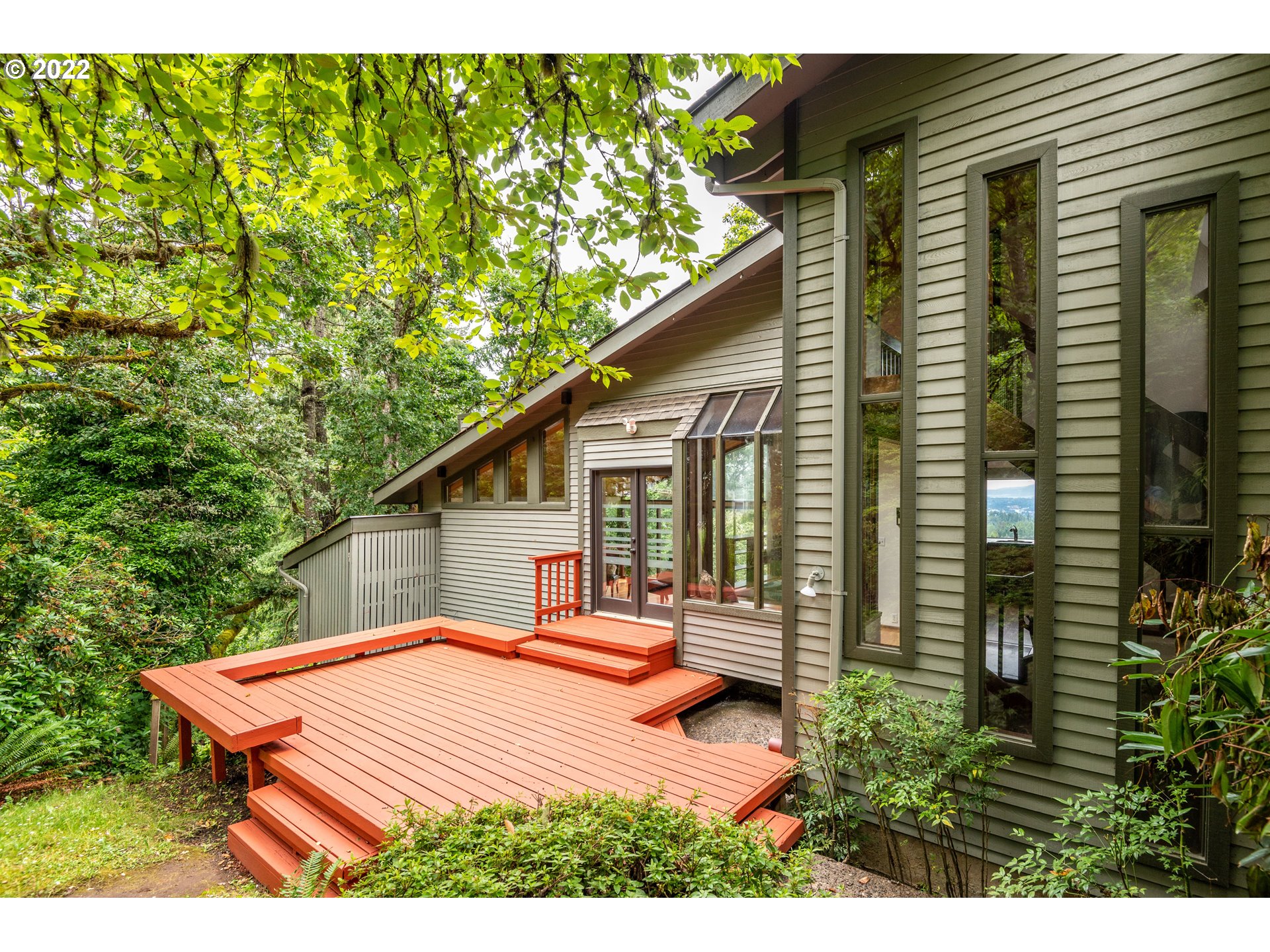 635 Startouch Drive Eugene, OR 97405 - Photo 26 of 28 a backyard of a house with wooden floor and outdoor seating