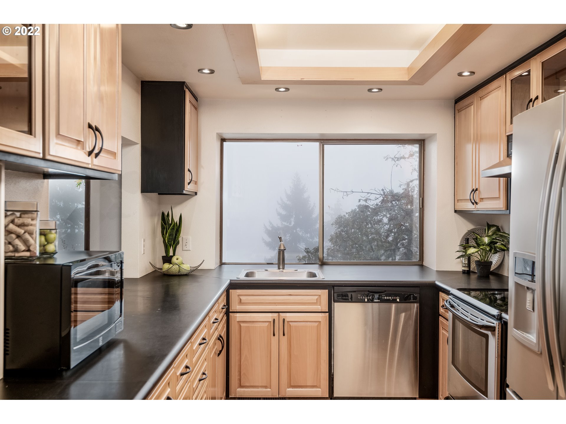 635 Startouch Drive Eugene, OR 97405 - Photo 10 of 28 a kitchen with stainless steel appliances granite countertop a refrigerator and a sink