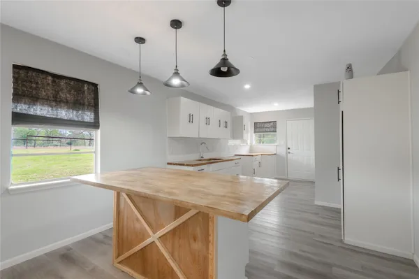 a view of a kitchen and a stove