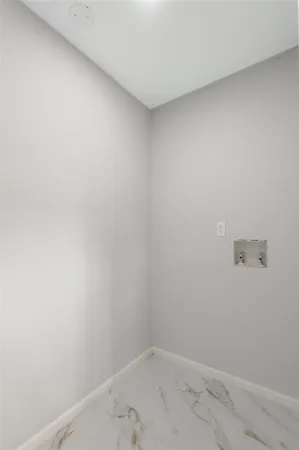 a room with a sink cabinets and wooden floor