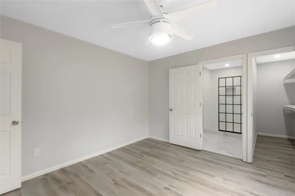a bathroom with a toilet a sink and a mirror