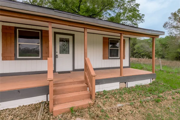 a front view of a house with a porch