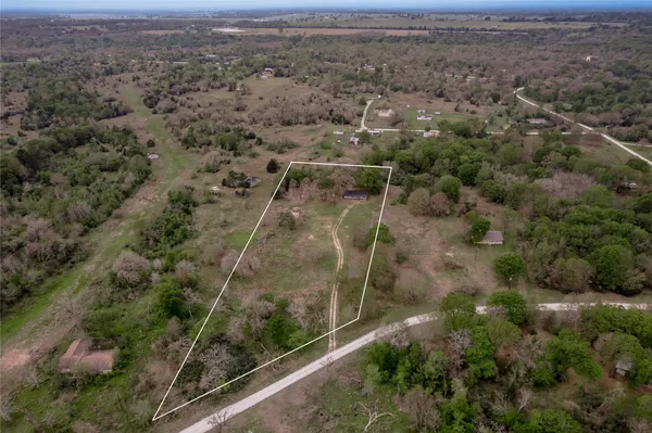an aerial view of residential house with outdoor space