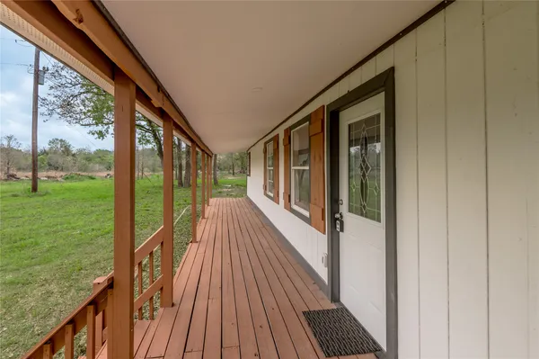 a view of balcony with wooden floor and outdoor space
