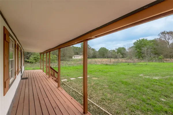 a view of outdoor space with deck and wooden floor