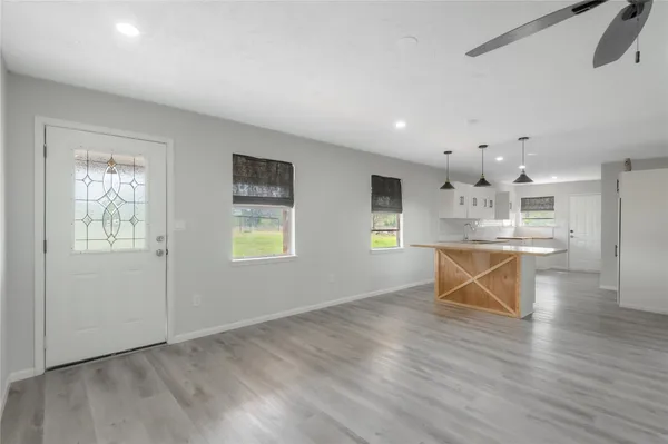 a view of kitchen with furniture and wooden floor