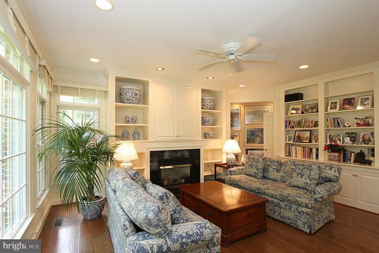5119 Warren Place Northwest Washington, DC 20016 - Photo 12 of 30 a living room with furniture and a fireplace
