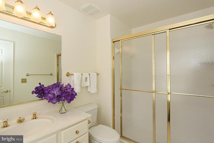 5119 Warren Place Northwest Washington, DC 20016 - Photo 16 of 30 a bathroom with a sink toilet and shower