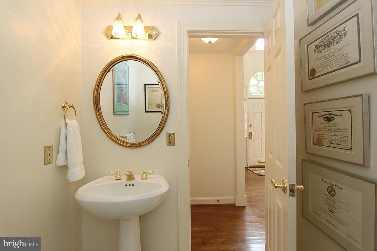 5119 Warren Place Northwest Washington, DC 20016 - Photo 18 of 30 a bathroom with a sink and a mirror