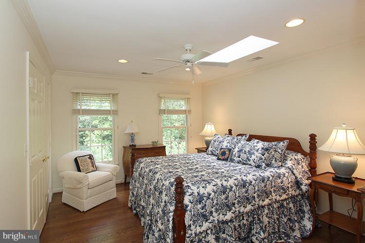 5119 Warren Place Northwest Washington, DC 20016 - Photo 23 of 30 a bedroom with a bed and a couch