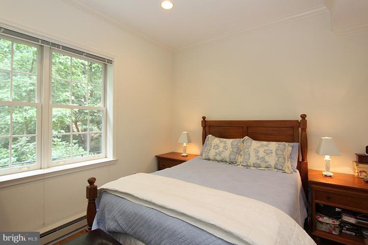5119 Warren Place Northwest Washington, DC 20016 - Photo 26 of 30 a bedroom with a bed and window