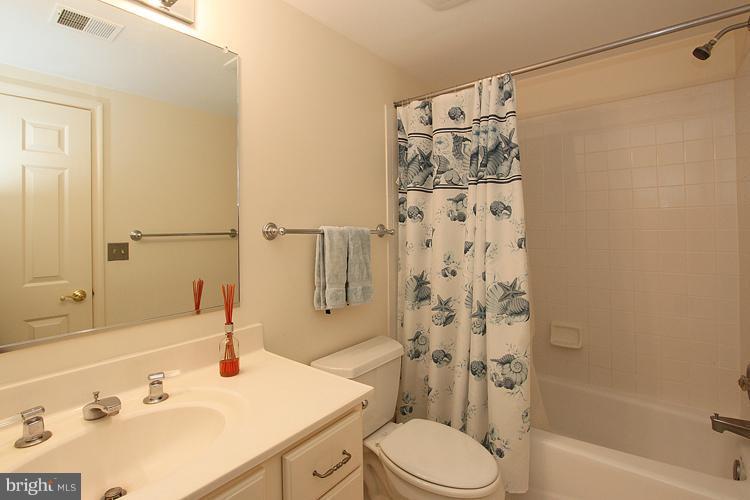 5119 Warren Place Northwest Washington, DC 20016 - Photo 28 of 30 a bathroom with a sink toilet and shower