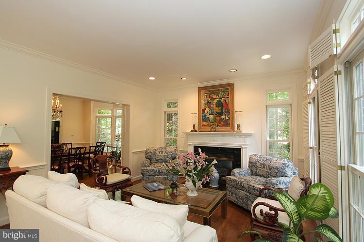5119 Warren Place Northwest Washington, DC 20016 - Photo 5 of 30 a living room with furniture and a fireplace