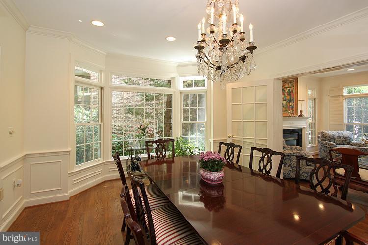 5119 Warren Place Northwest Washington, DC 20016 - Photo 7 of 30 a view of a dining room with furniture a chandelier and wooden floor