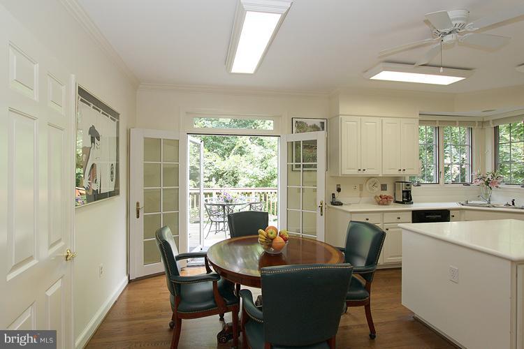 5119 Warren Place Northwest Washington, DC 20016 - Photo 10 of 30 a view of a dining room with furniture window and wooden floor