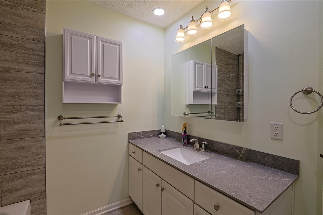 4307 Meadowcroft Road Dayton, OH 45429 - Photo 16 of 26 This bathroom features a sleek vanity with ample storage, creating a functional and stylish space.