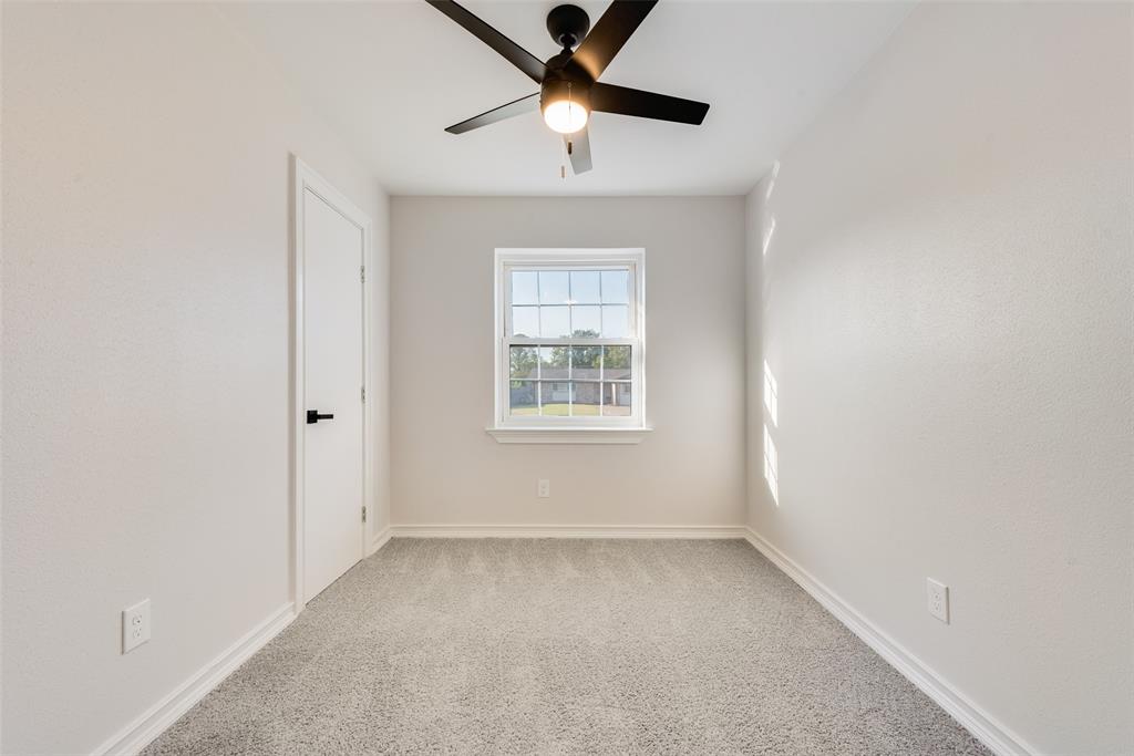 4117 Spokane Street Irving, TX 75062 - Photo 25 of 28 a view of room with window and ceiling fan