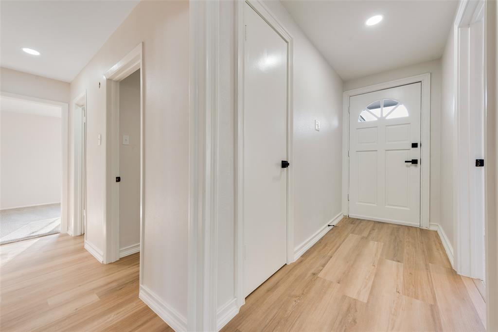4117 Spokane Street Irving, TX 75062 - Photo 6 of 28 a view of a hallway with wooden floor