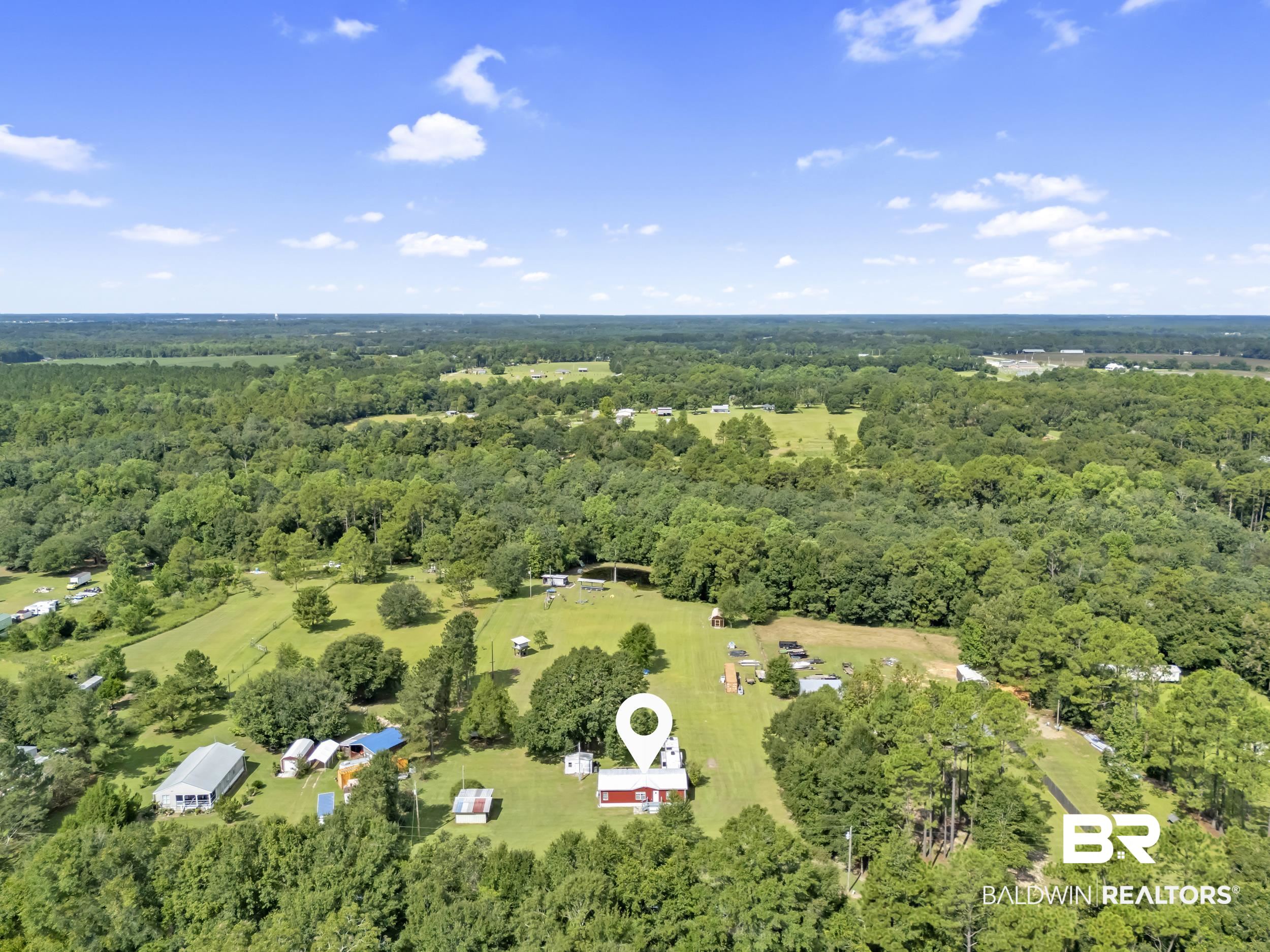 22823 Lanier Road Robertsdale, AL 36567 - Photo 8 of 46 Aerial overview of property's location featuring a heavily wooded area