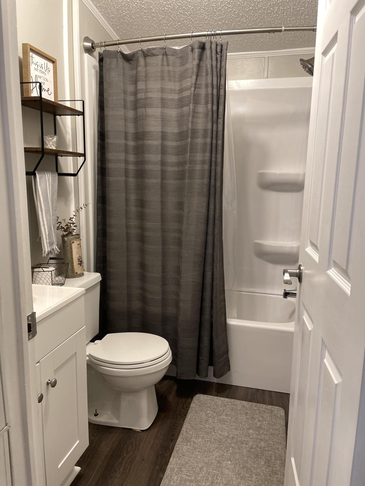 2166 Healing Springs Road Blackville, SC 29817 - Photo 26 of 43 a bathroom with a shower toilet and sink