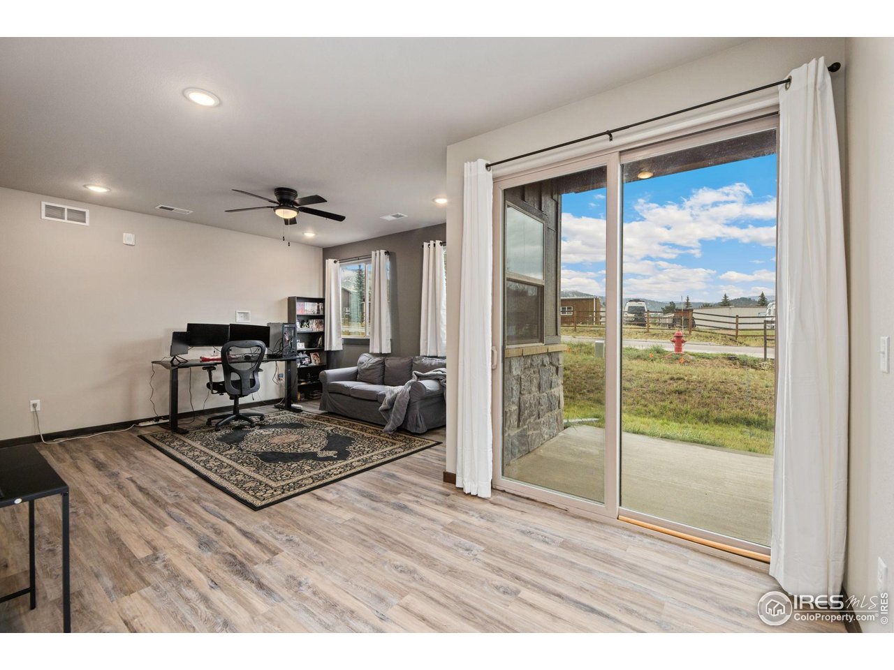1734 Wildfire Road, Unit 102 Estes Park, CO 80517 - Photo 3 of 33 a living room with furniture