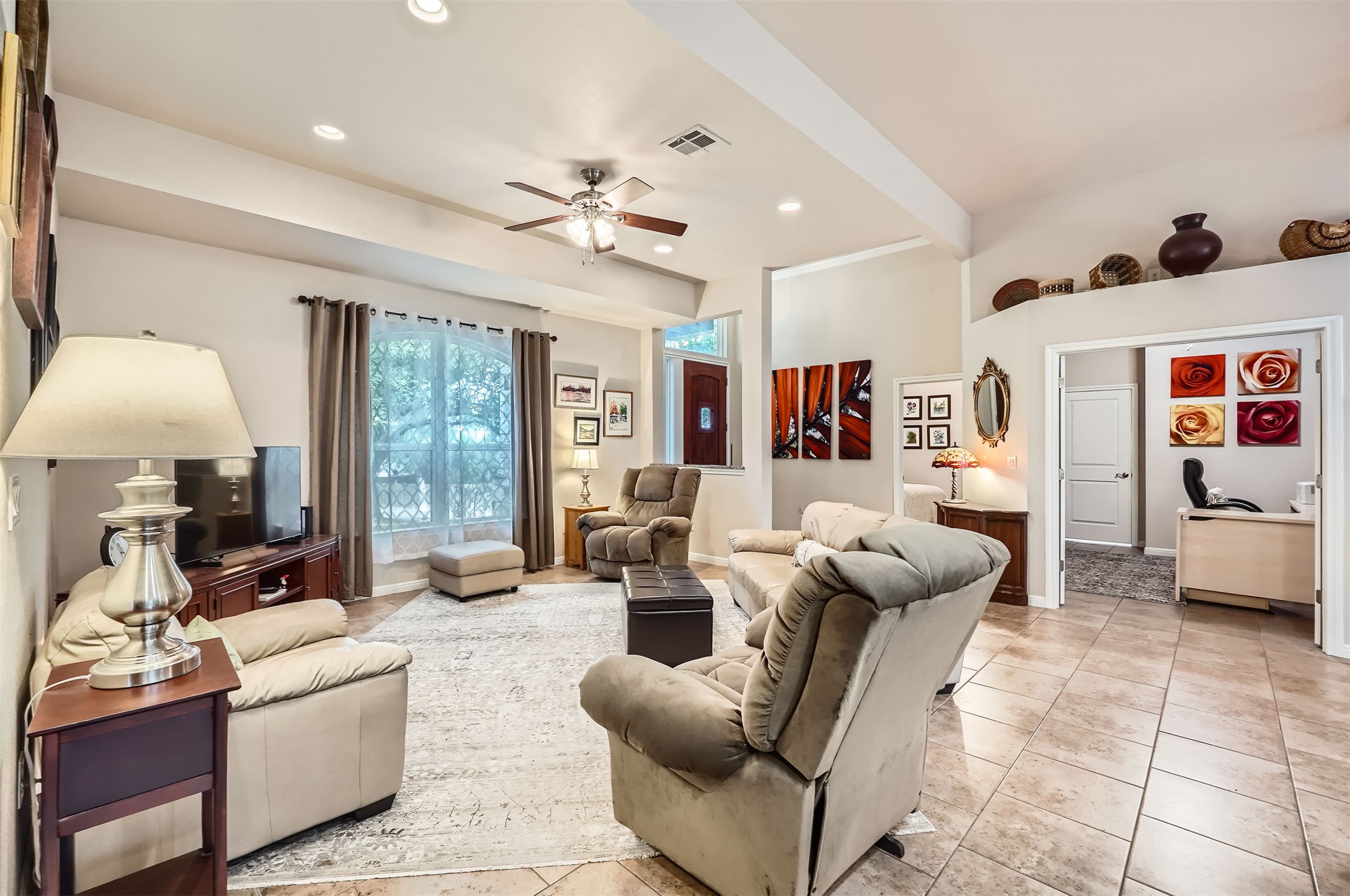 5501 Hitching Post Lago Vista, TX 78645 - Photo 6 of 26 a living room with furniture a lamp and a large window