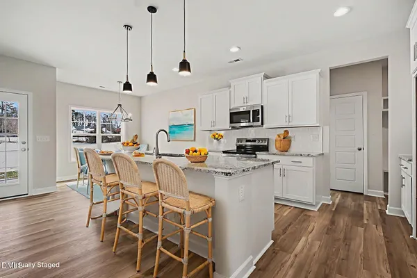 wooden floor in an empty room with a fireplace