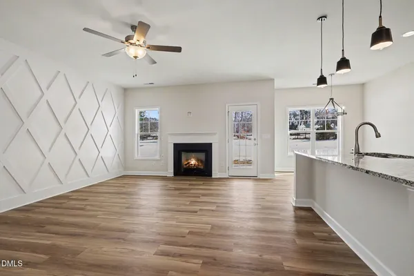 a view of a hallway with a hardwood floor