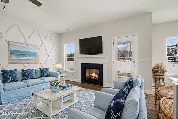 a view of an empty room with a ceiling fan