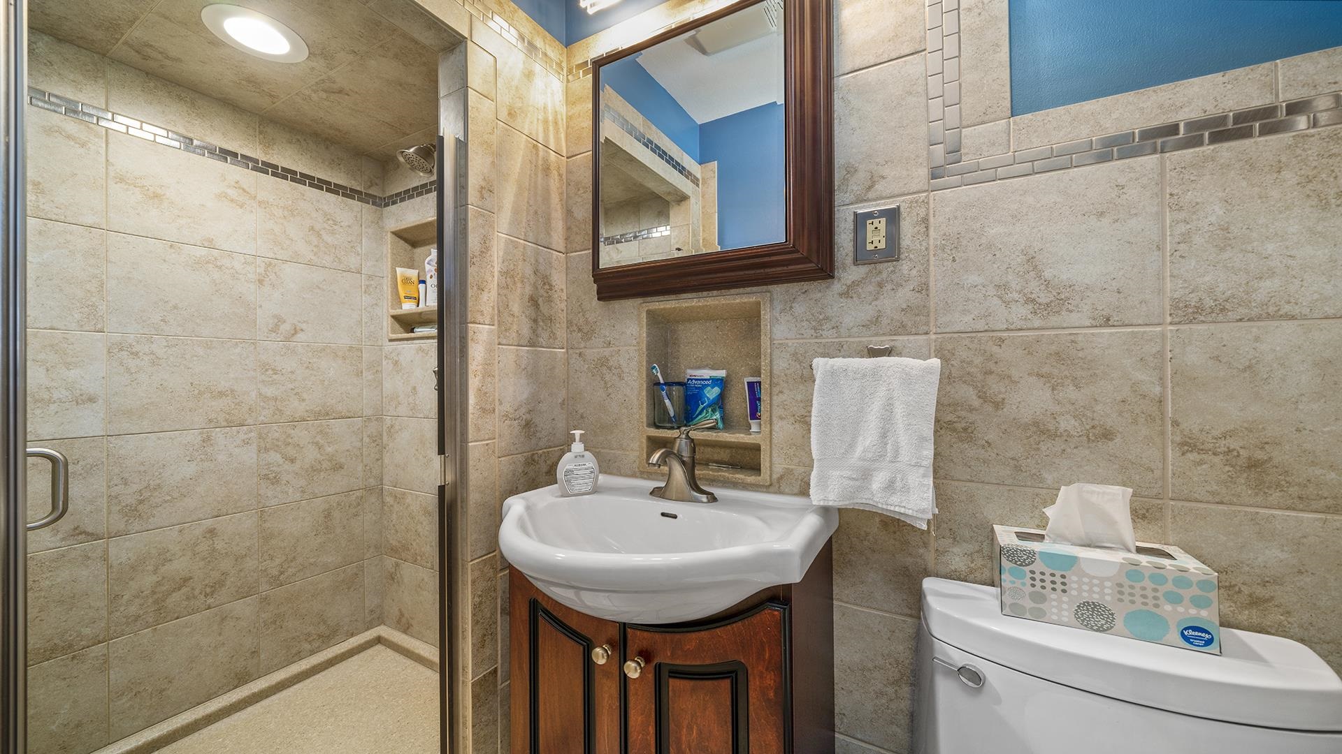 3848 Highcrest Road Rockford, IL 61107 - Photo 20 of 29 a bathroom with a sink a toilet and shower