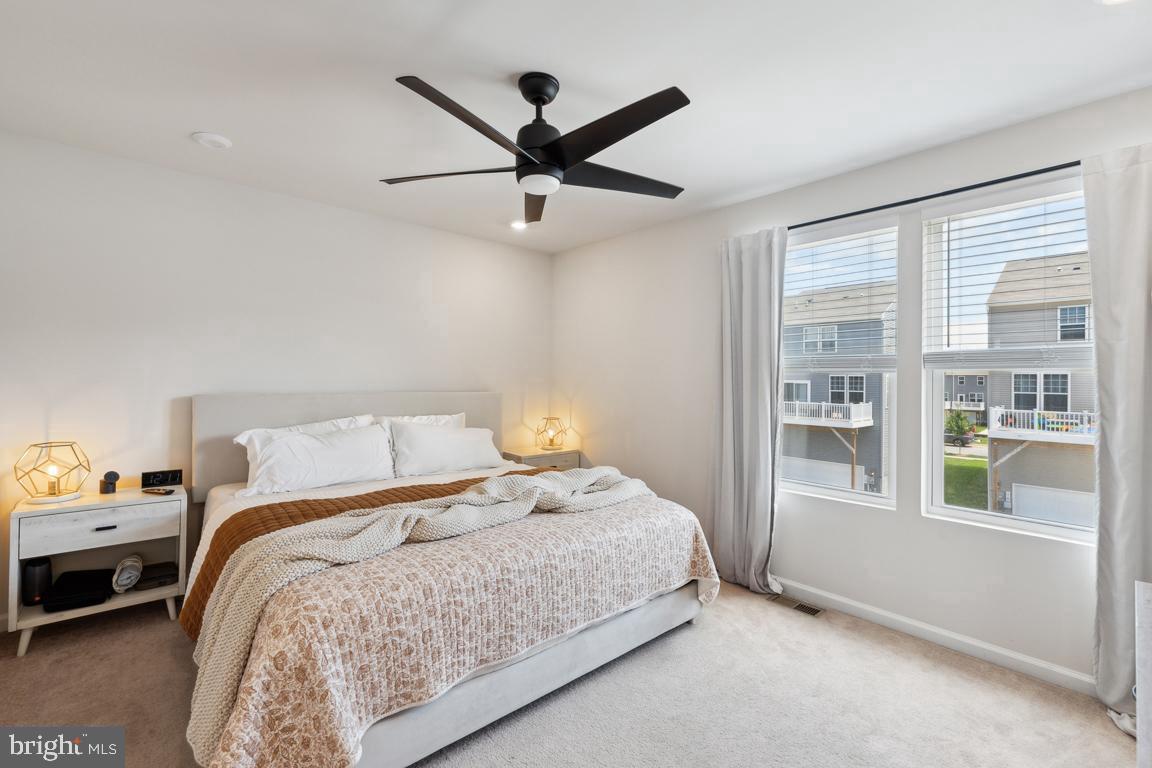 195 Presidents Pointe Avenue Ranson, WV 25438 - Photo 15 of 22 a bedroom with a bed and a large window
