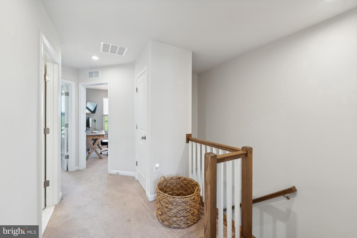 195 Presidents Pointe Avenue Ranson, WV 25438 - Photo 18 of 22 a living room with furniture and a potted plant