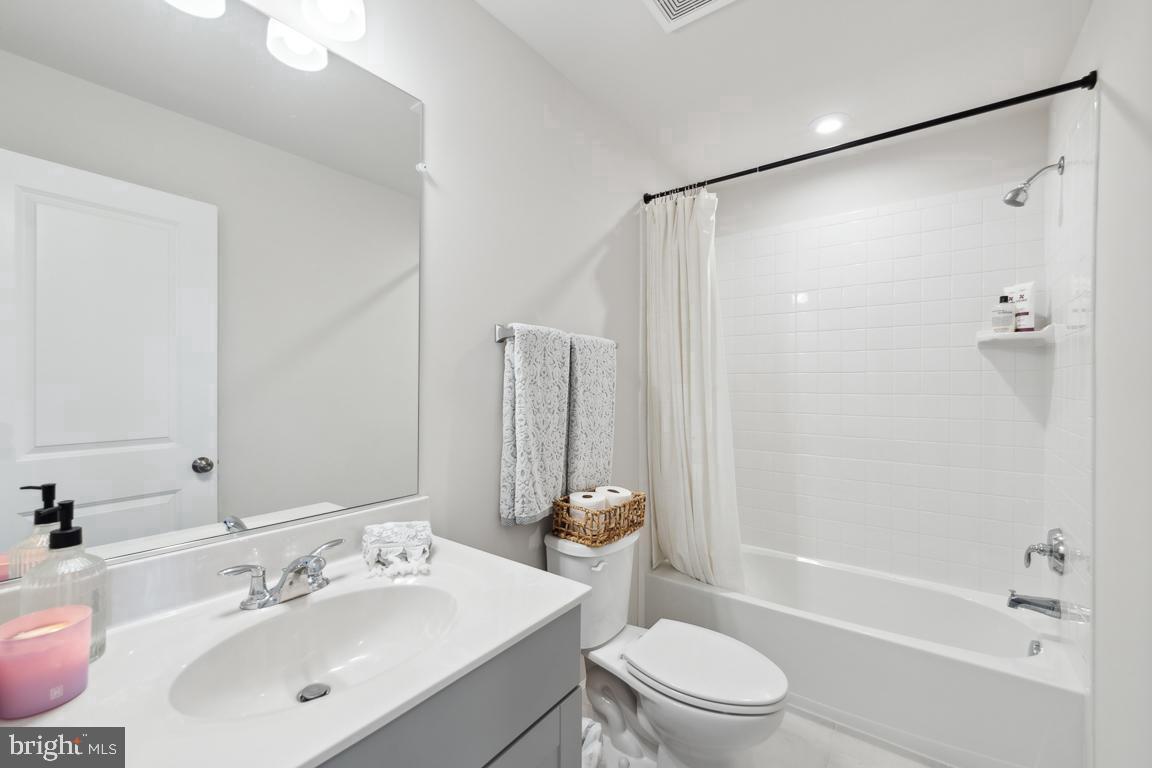 195 Presidents Pointe Avenue Ranson, WV 25438 - Photo 6 of 22 a bathroom with a sink a toilet and shower