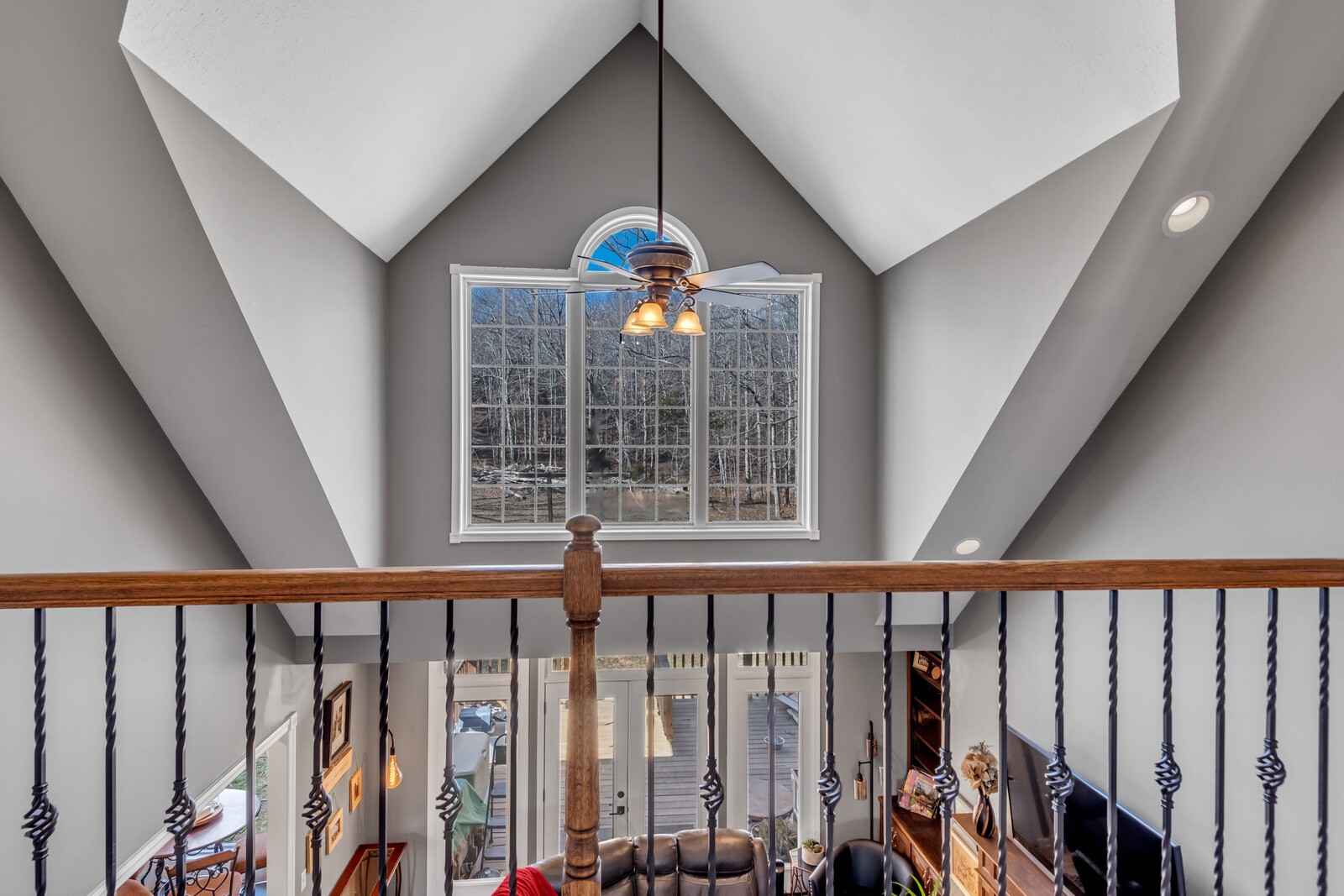 285 Heggie Road Erin, TN 37061 - Photo 25 of 50 a very nice looking room with wooden floor and stairs