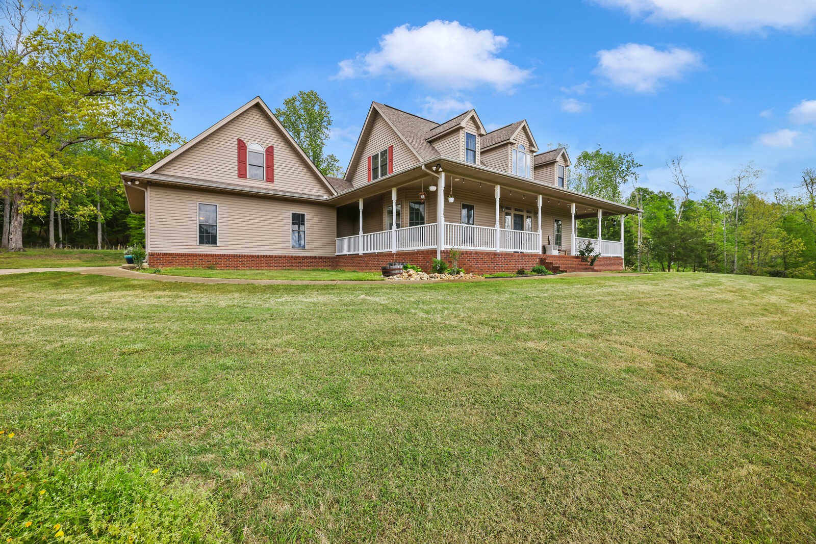 285 Heggie Road Erin, TN 37061 - Photo 35 of 50 a front view of a house with a garden