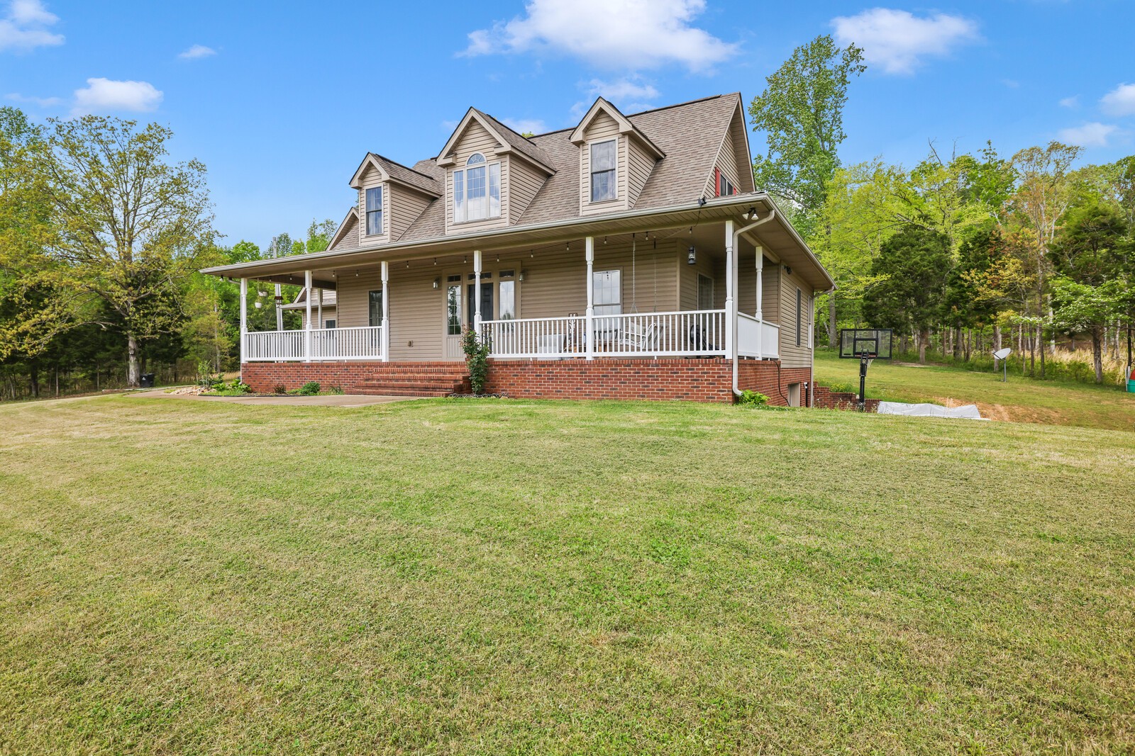 285 Heggie Road Erin, TN 37061 - Photo 36 of 50 a view of a house with a yard and sitting area