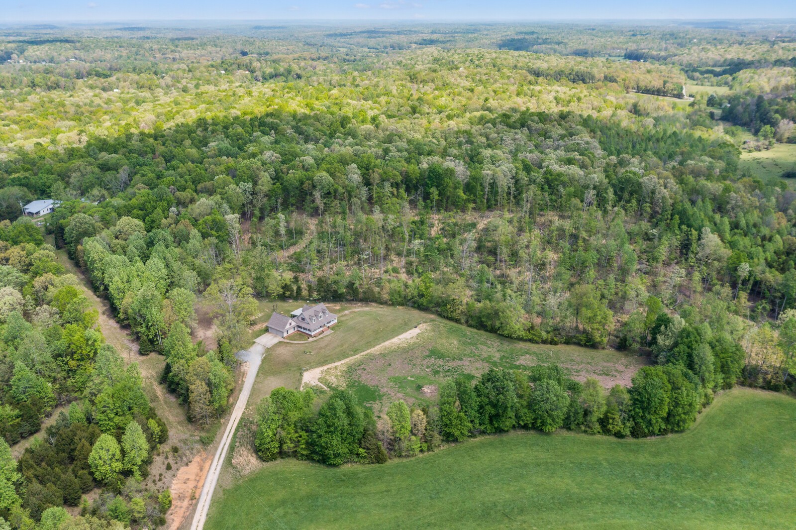285 Heggie Road Erin, TN 37061 - Photo 4 of 50 a view of a lake with a yard