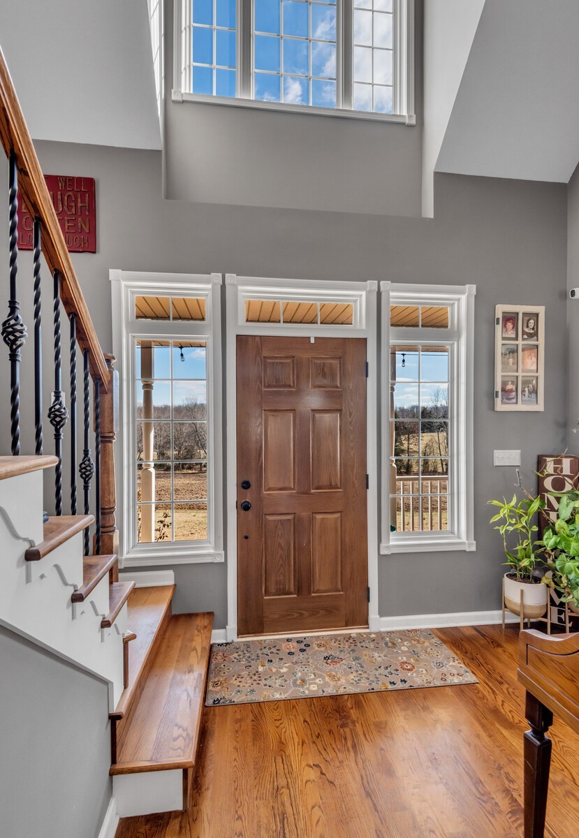 285 Heggie Road Erin, TN 37061 - Photo 6 of 50 a view of an entryway with wooden floor and door
