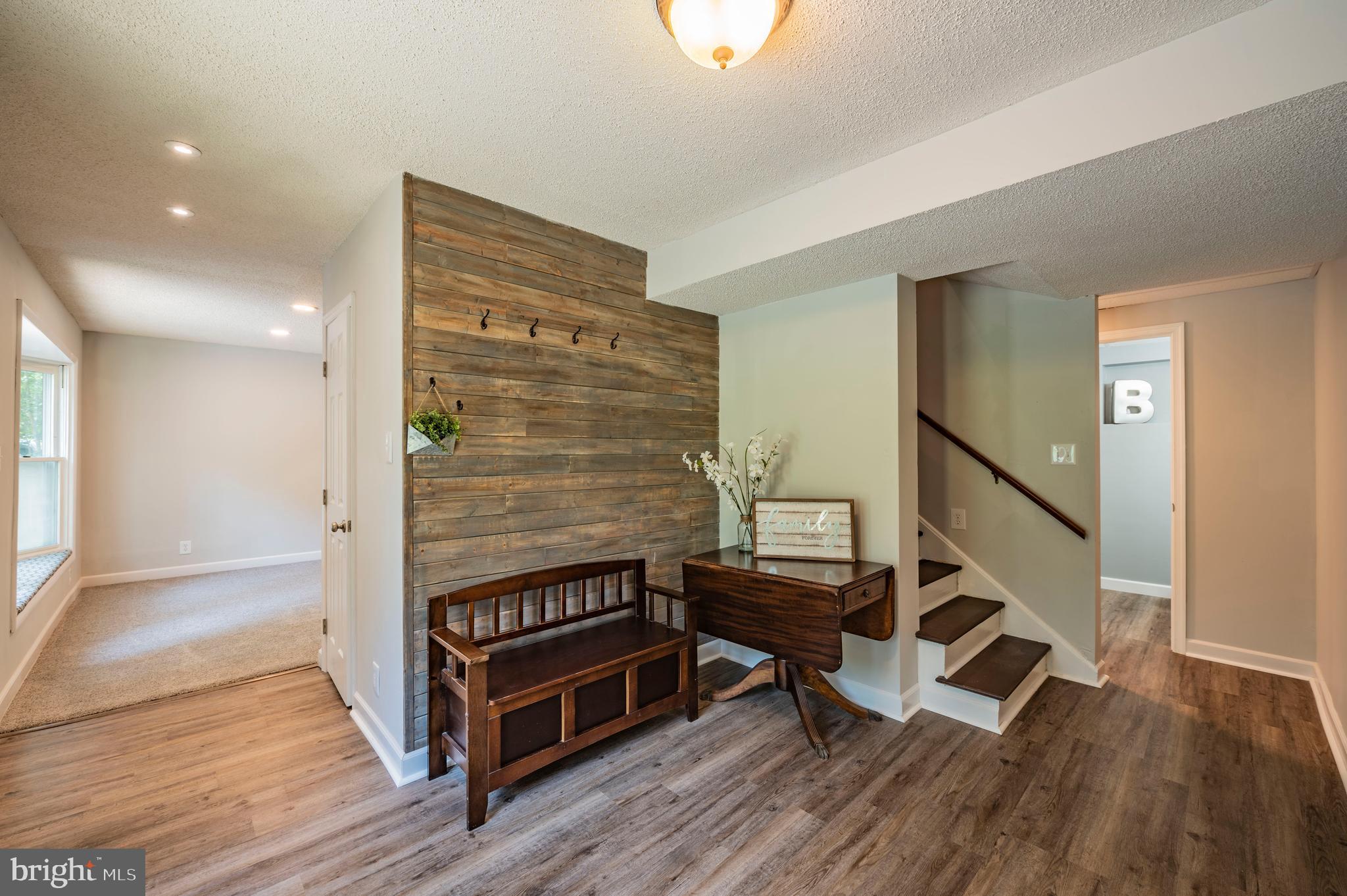 Large Foyer facing Full Bath & Laundry