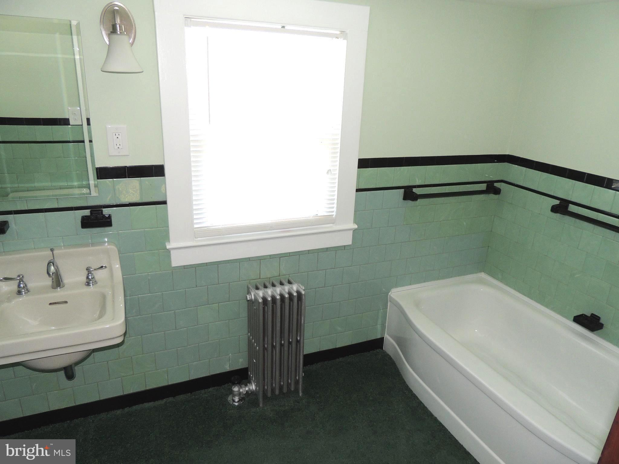 1421 Long Corner Road Mount Airy, MD 21771 - Photo 17 of 27 a bathroom with a sink and a bathtub