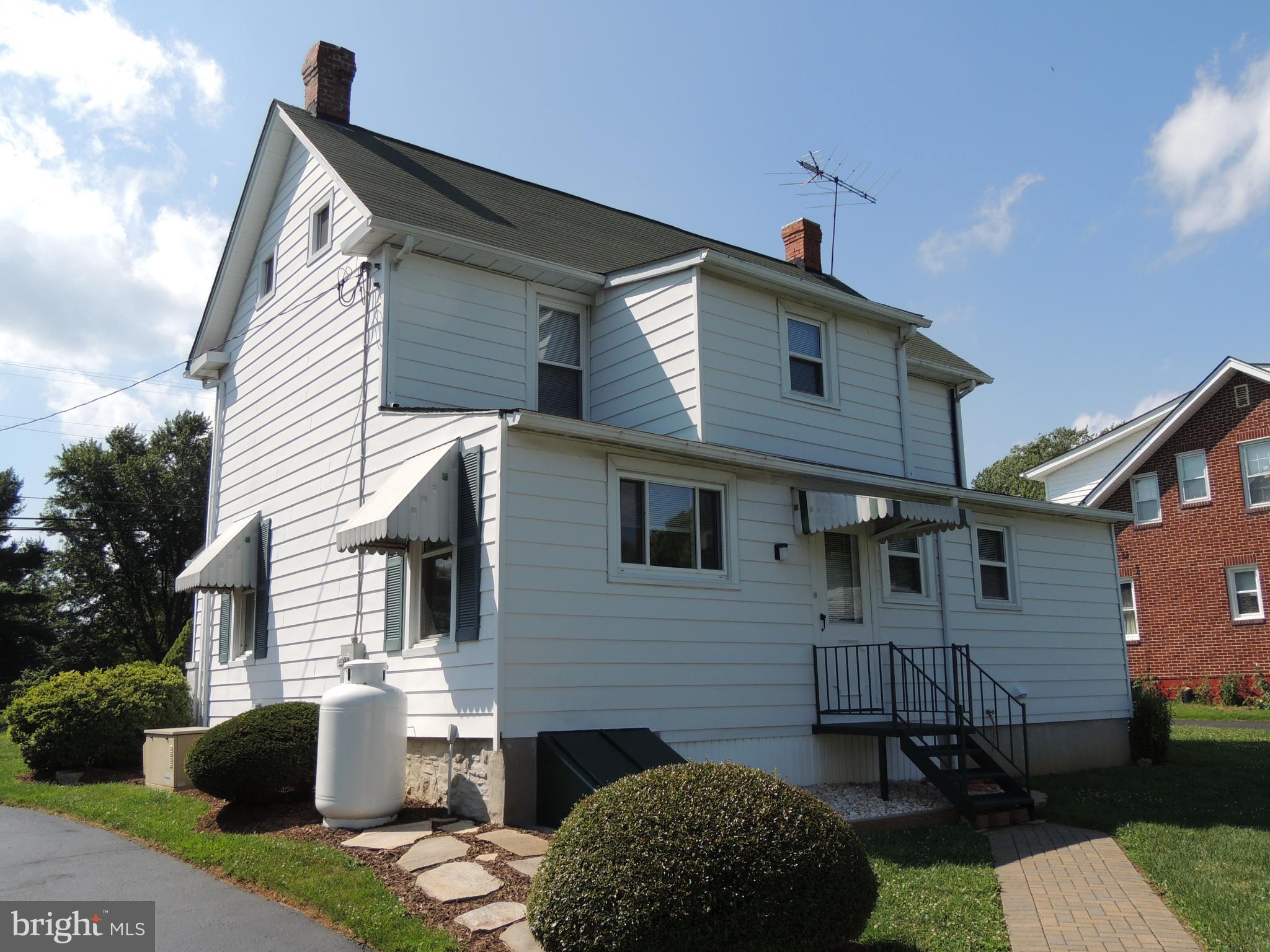 1421 Long Corner Road Mount Airy, MD 21771 - Photo 21 of 27 a front view of a house with a yard