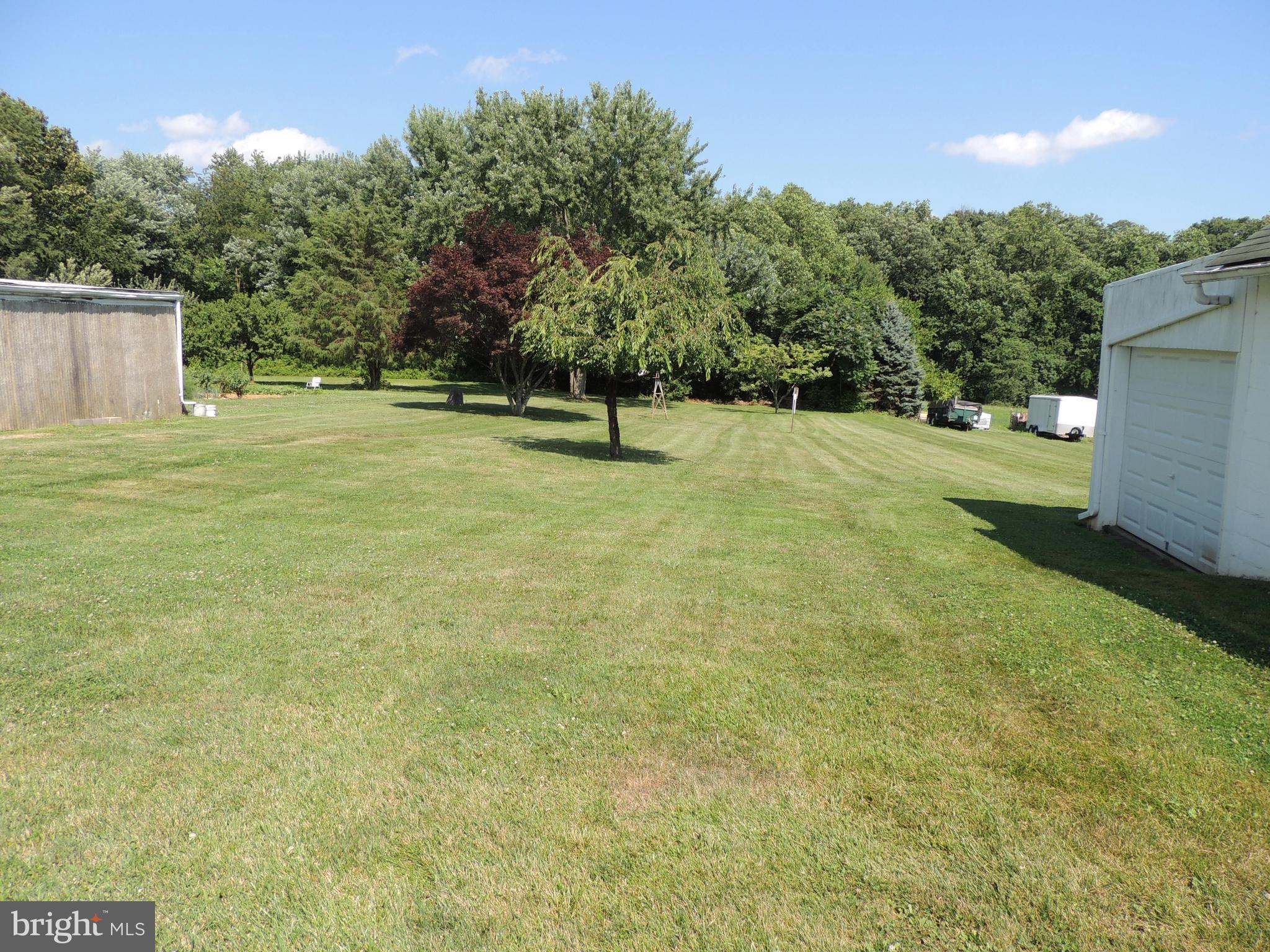 1421 Long Corner Road Mount Airy, MD 21771 - Photo 22 of 27 a view of a yard with a tree