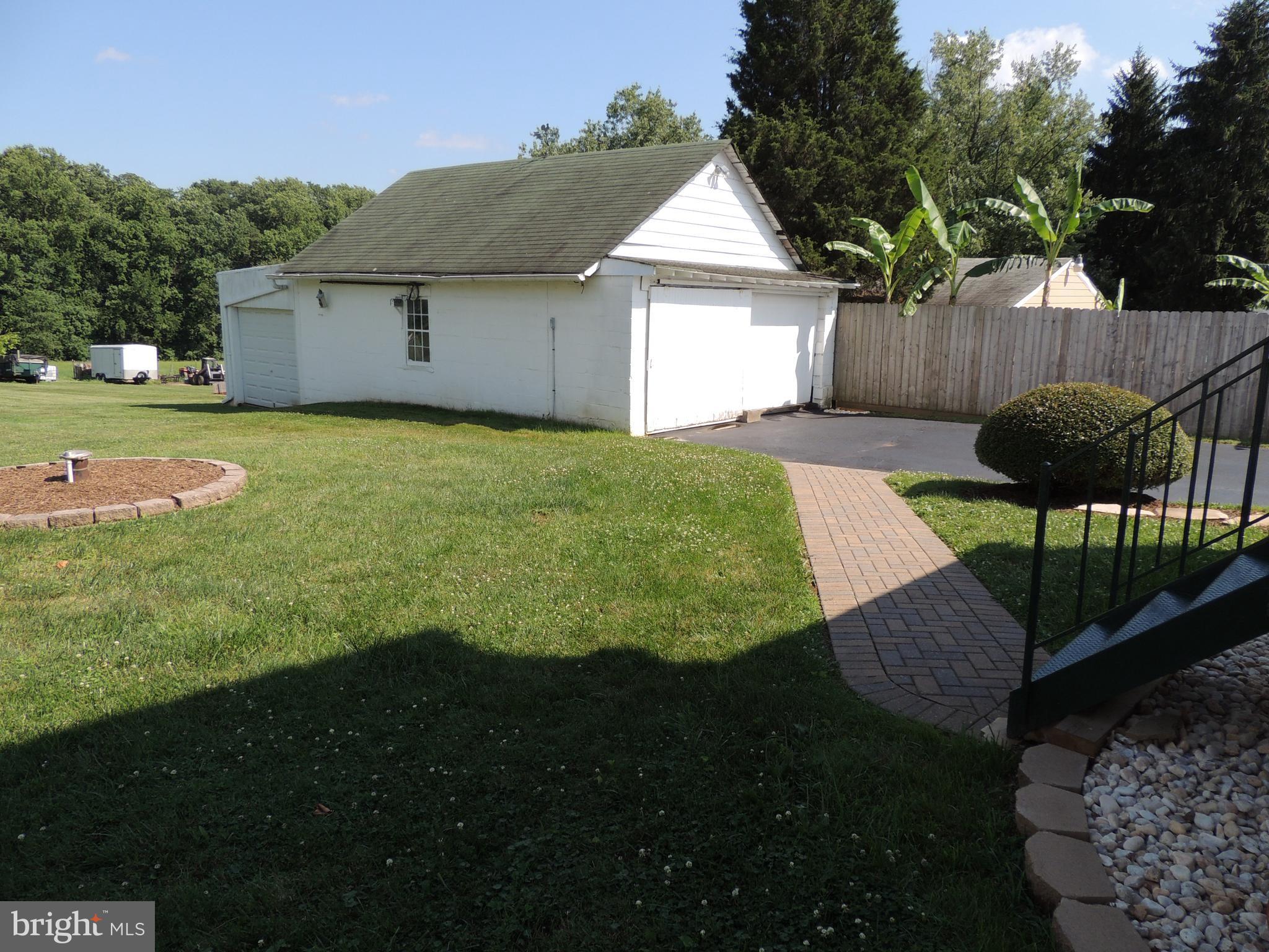 1421 Long Corner Road Mount Airy, MD 21771 - Photo 24 of 27 a front view of house with yard and outdoor seating