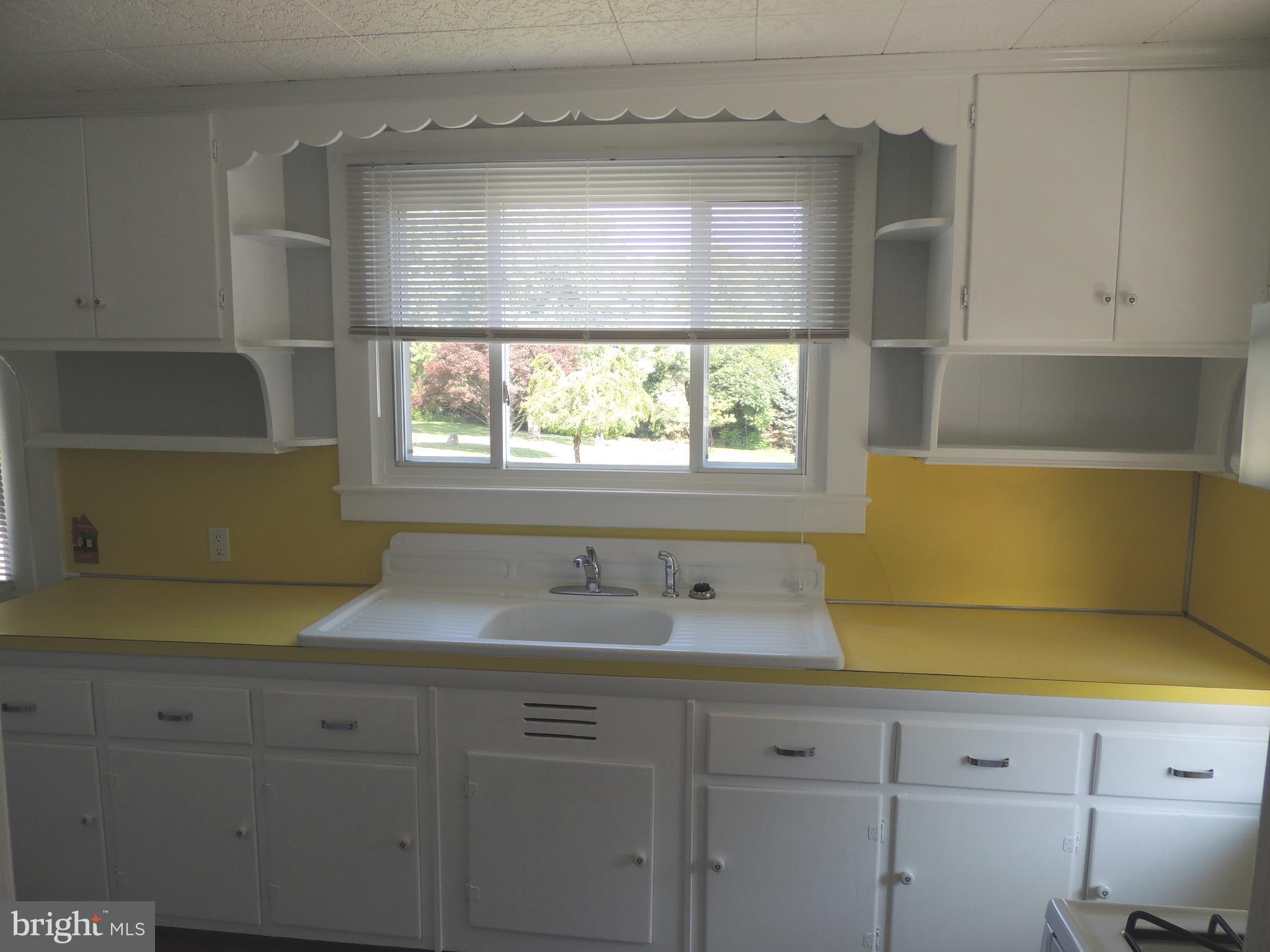 1421 Long Corner Road Mount Airy, MD 21771 - Photo 7 of 27 a kitchen with a sink and a window