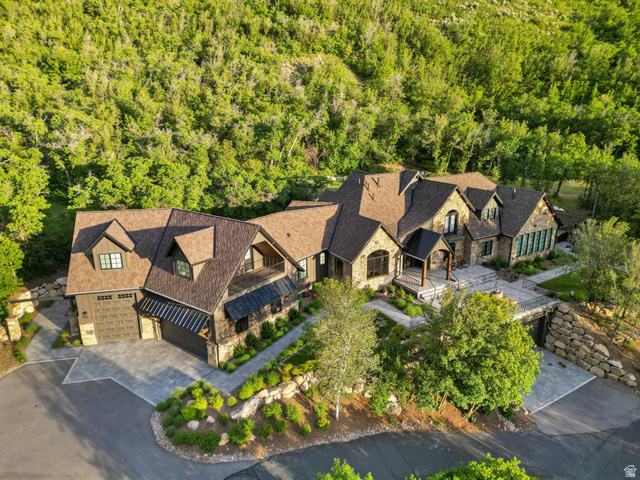 1141 South Oak Leaf Lane Springville, UT 84663 - Photo 1 of 147 Expansive multi-level residence featuring a stone and wood facade, multiple gabled roofs, and an attached two-car garage